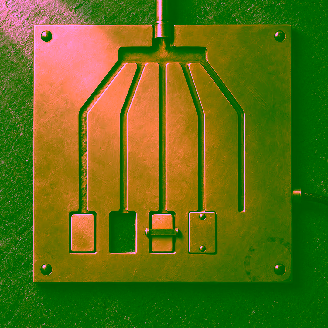 A square brass plate on dark slate with one keyed inlet at the top feeding five milled channels: the first ends at a blank tag seated flush in its recess, the second at an open empty recess, the third at a tag held behind a closed cross bar, the fourth at a recess covered by a screwed-down flat plate, and the fifth in solid brass with no recess at all, while a separate brown cord enters the plate through a fitting on the right edge.